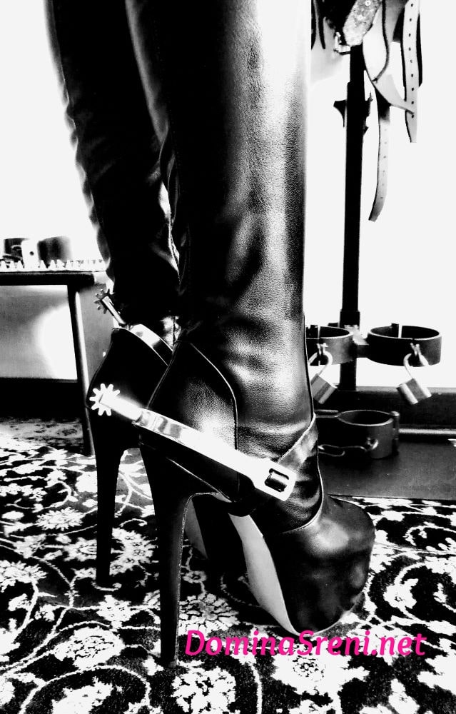 Domina Sreni Italian Mistress in  Milano wearing over knee fetish leather boots with spurs