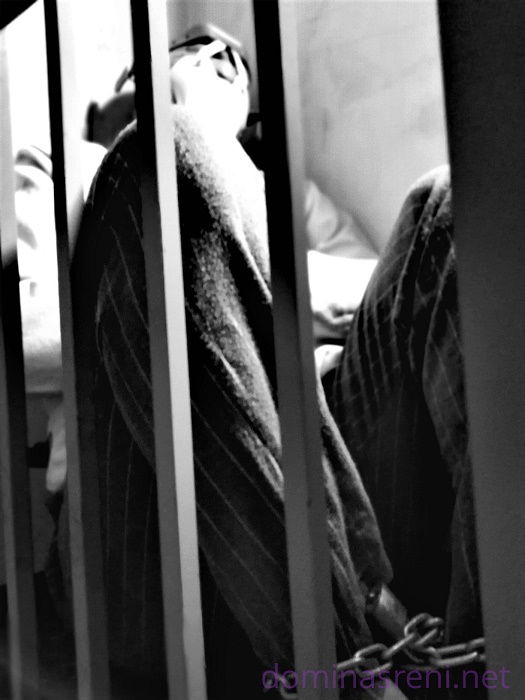 Prison slave in cage detention